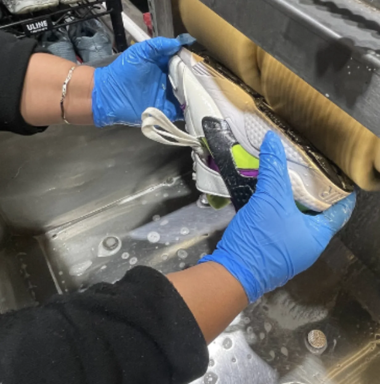 A returned sneaker cleaned by hand before its second life